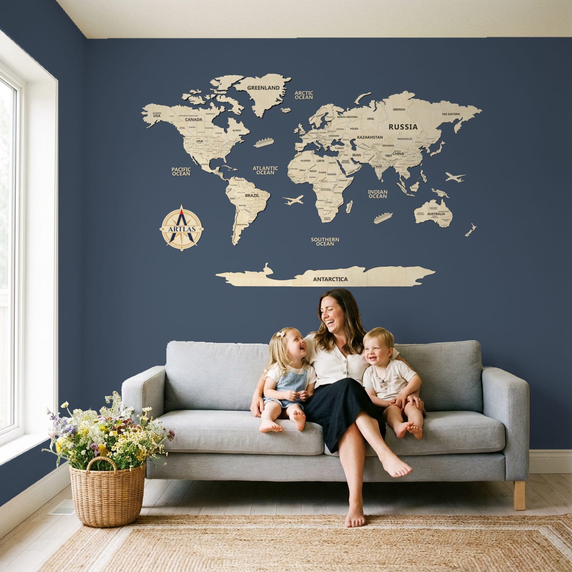 A family on a sofa beneath the map in birch