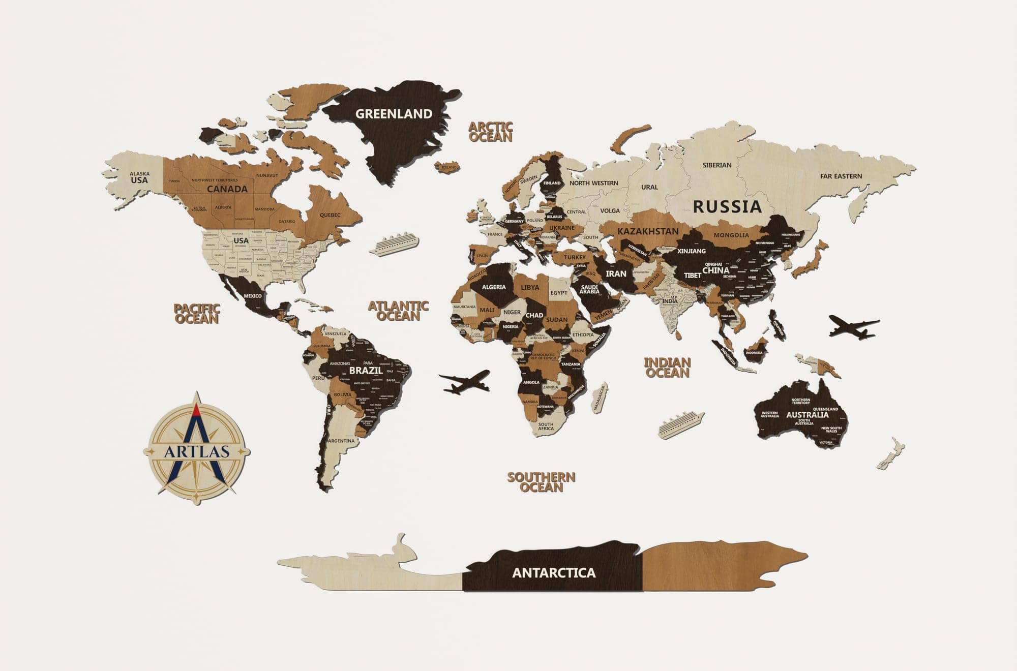 The Wooden World Map in birch, teak and walnut, on a plain studio wall