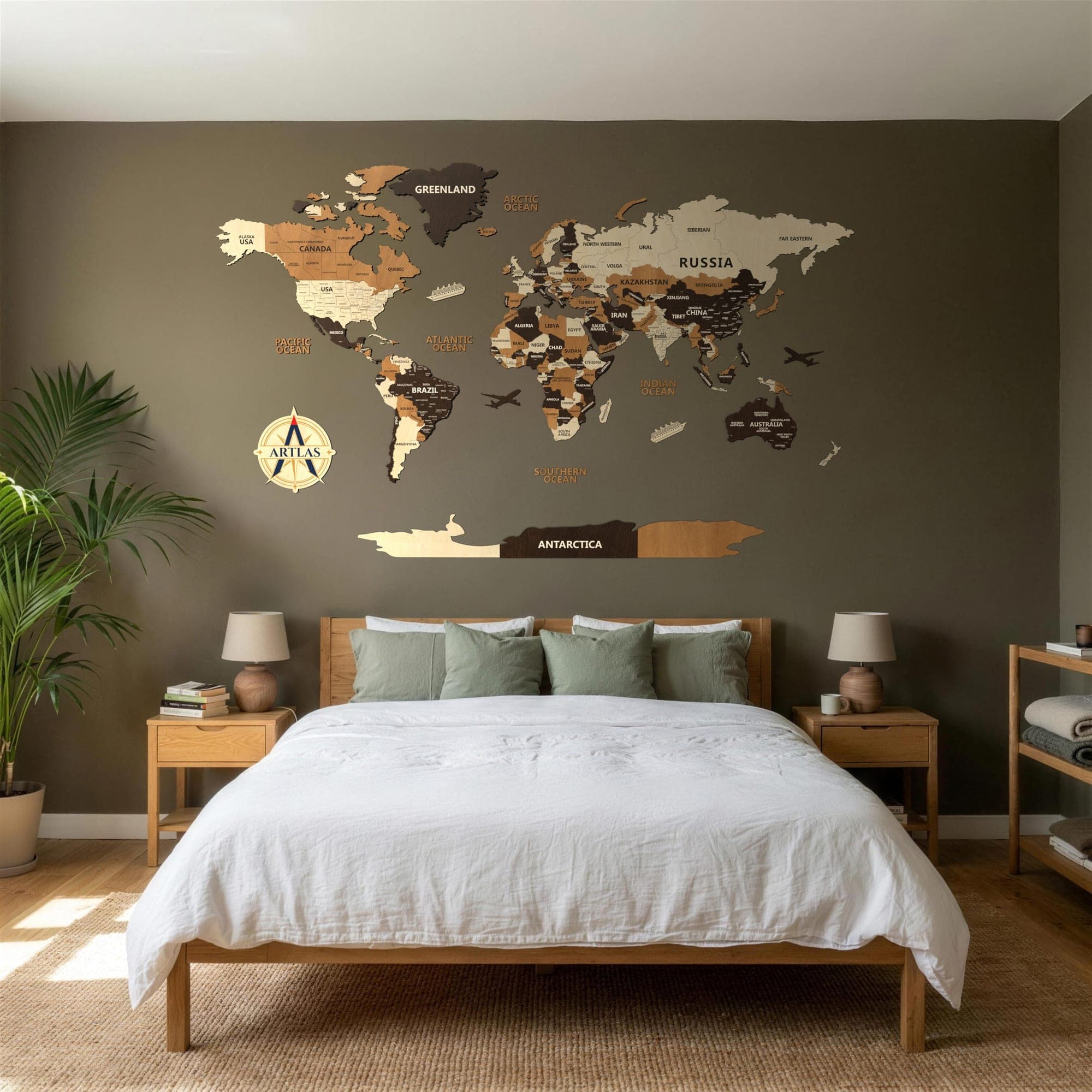 The Wooden World Map in birch, teak and walnut on a dark bedroom wall