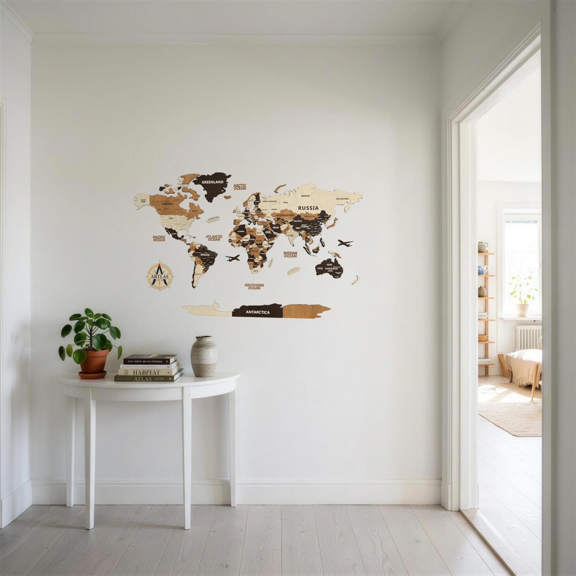 The Wooden World Map in birch, teak and walnut in an entrance hall