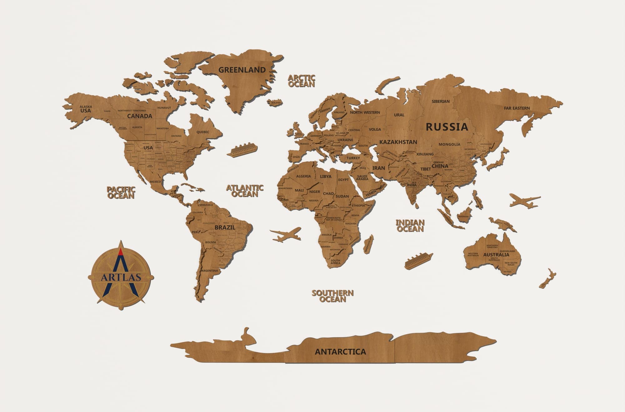 The Wooden World Map in teak, on a plain studio wall