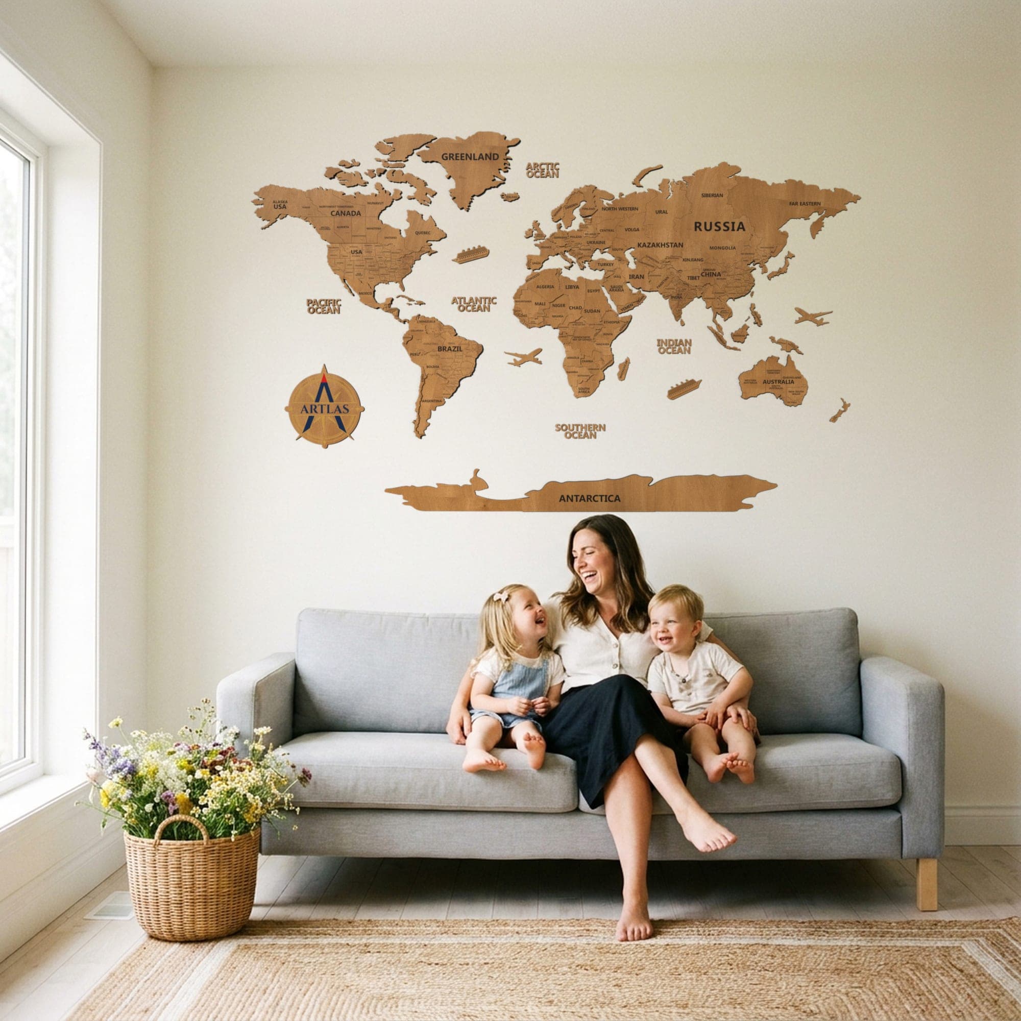 A family on a sofa beneath the map in teak