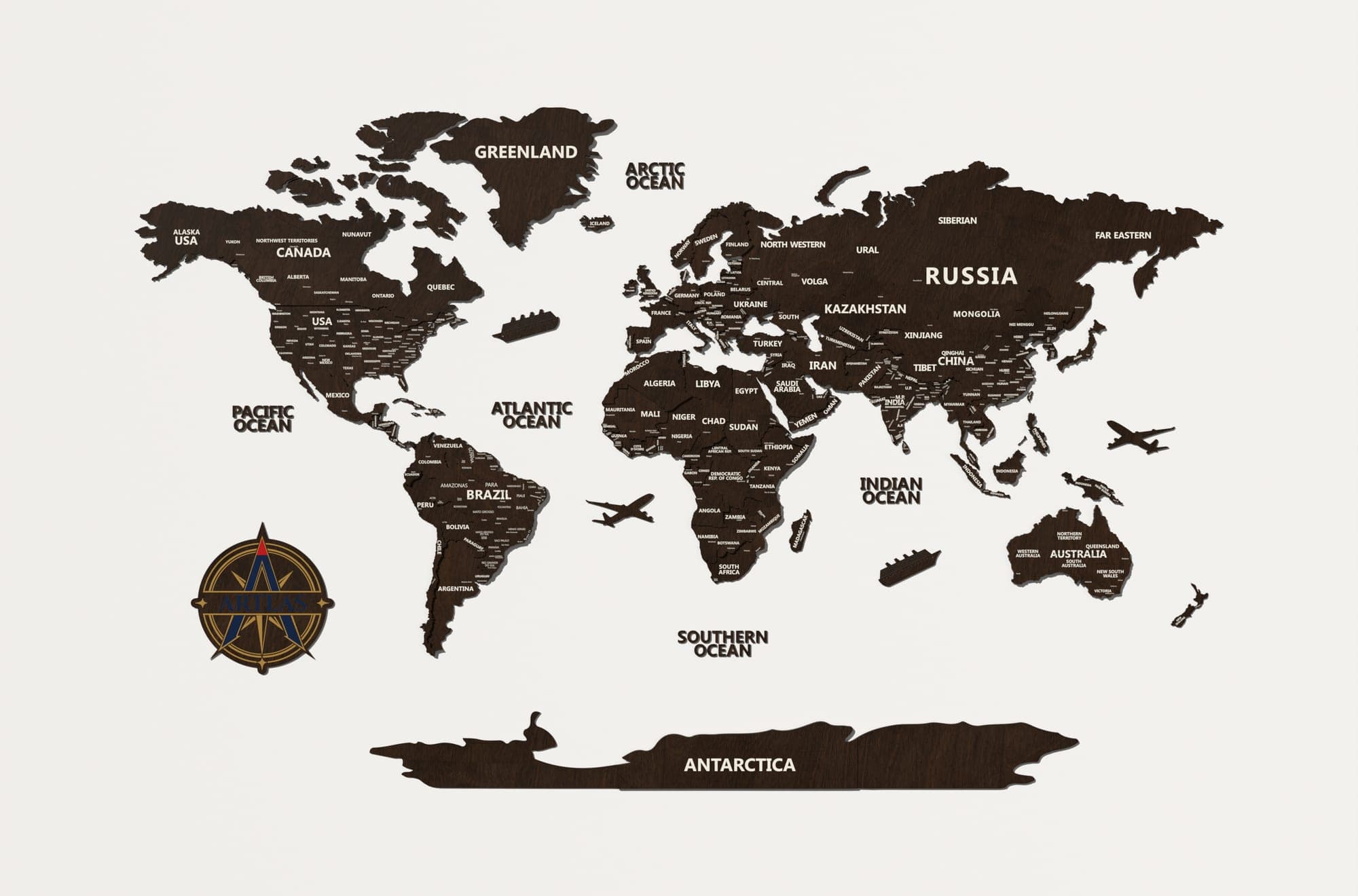 The Wooden World Map in walnut, on a plain studio wall