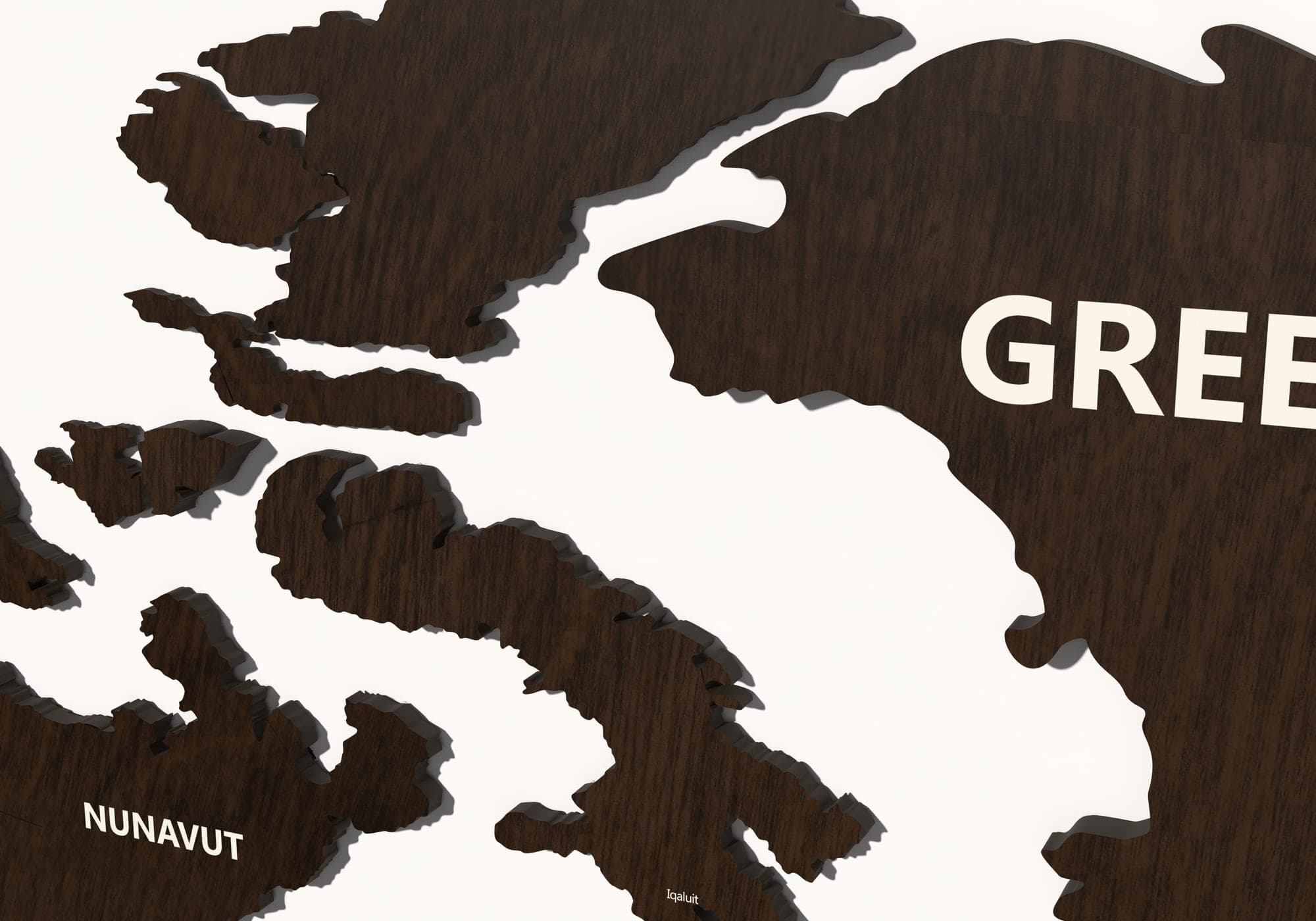 The layers of the map in walnut close up — the cut edges and the shadow between them