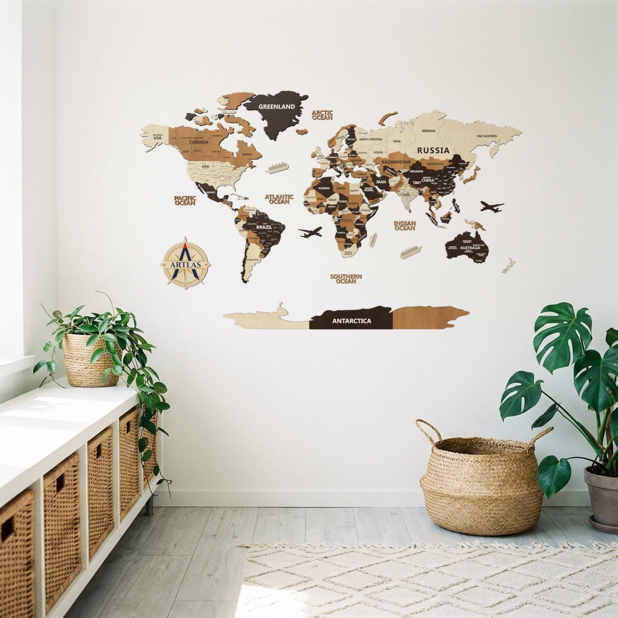 The Wooden World Map in birch, teak and walnut on a wall above a console